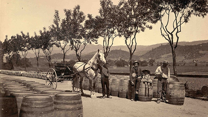 Beringer Brothers preparing to load wooden wine barrels onto a horse and buggy in 1876