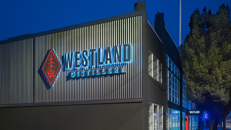 Exterior view of the Westland Distillery sign on the side of their distillery
