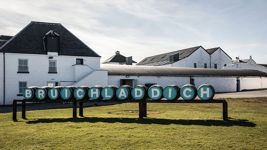 Painted barrels outside a Scottish distillery spell out Bruichladdich
