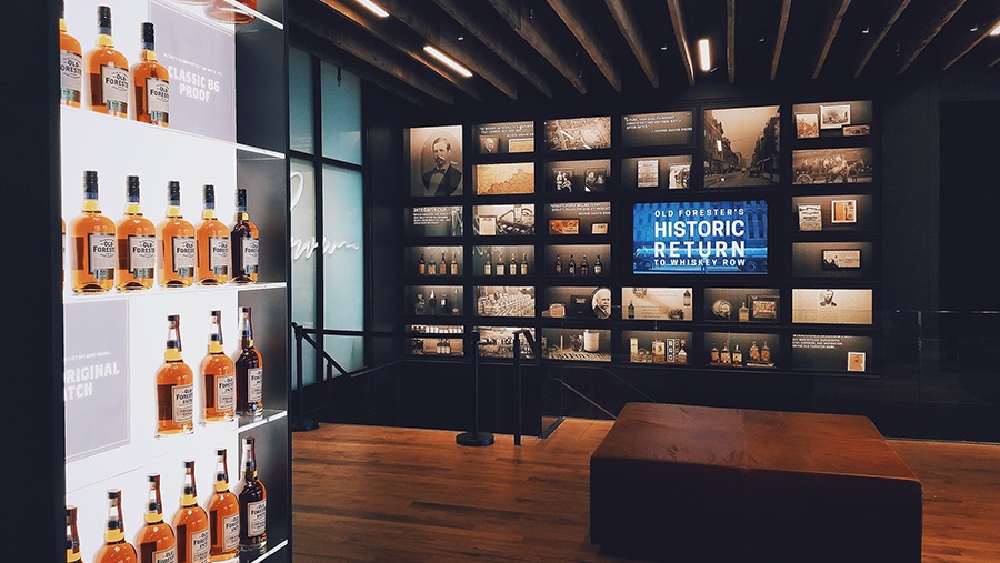 room with glass cases and shelves featuring old forest whisky and vintage memorabilia