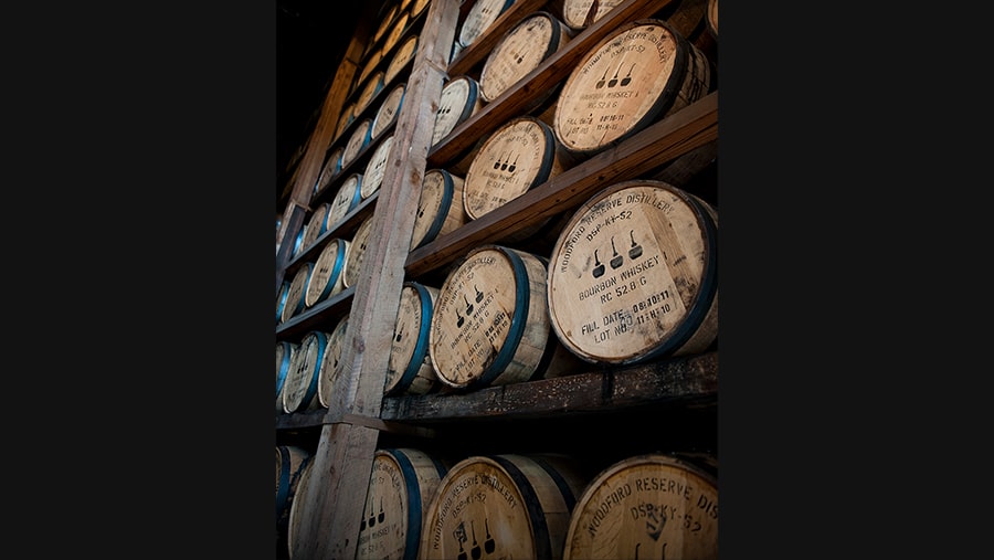 Interior shot of Woodford Reserve warehouse with stacks of barrels on shelves