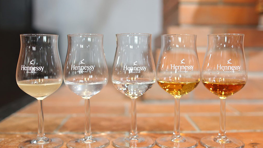 A row of Hennessy glasses filled with eau de vie